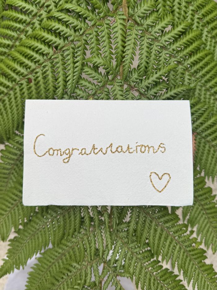 Hand-embroidered Congratulations card in gold thread on handmade paper