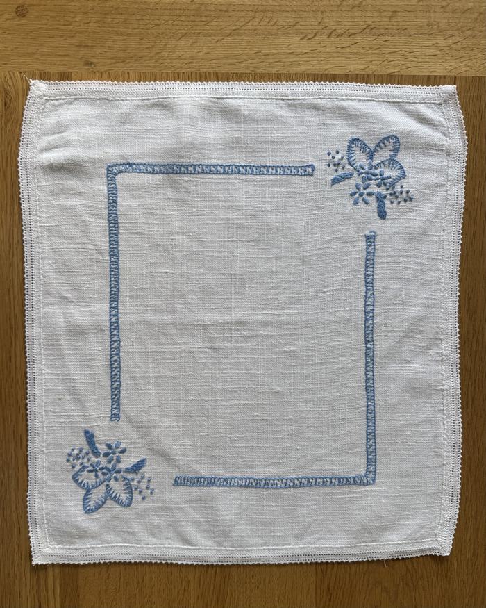 French linen placemat, blue frame and florals