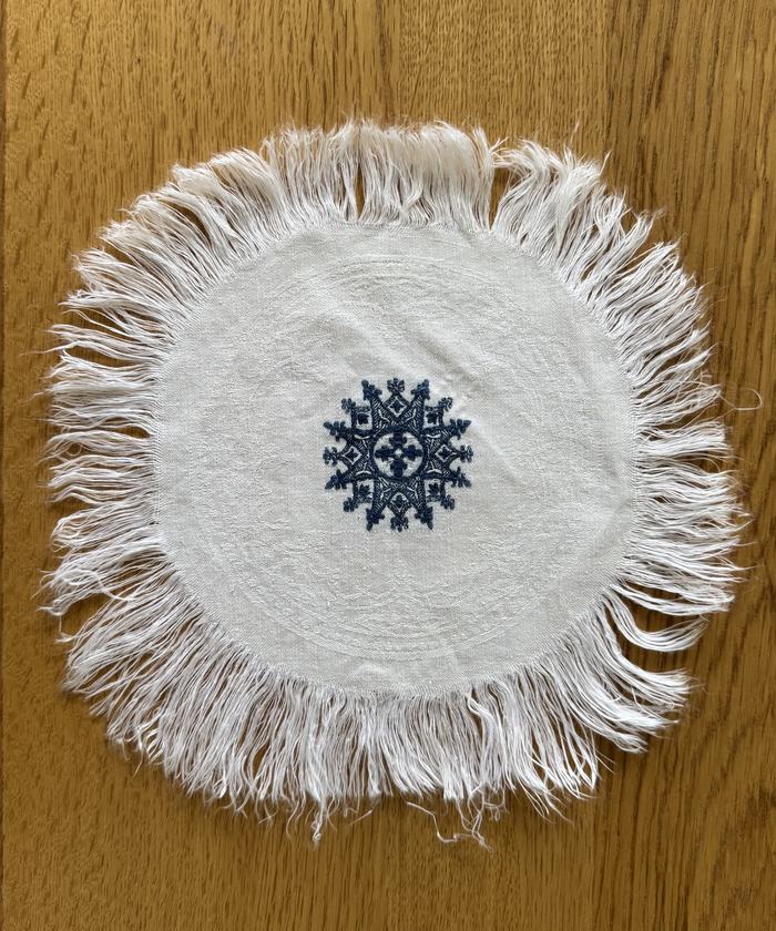 French fringed linen doily, embroidered motif
